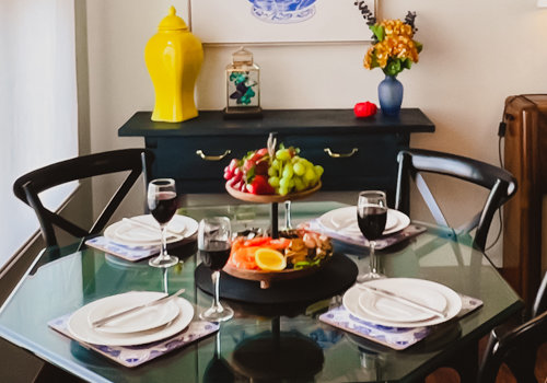 Dining table with fresh fruit and meats for lunch